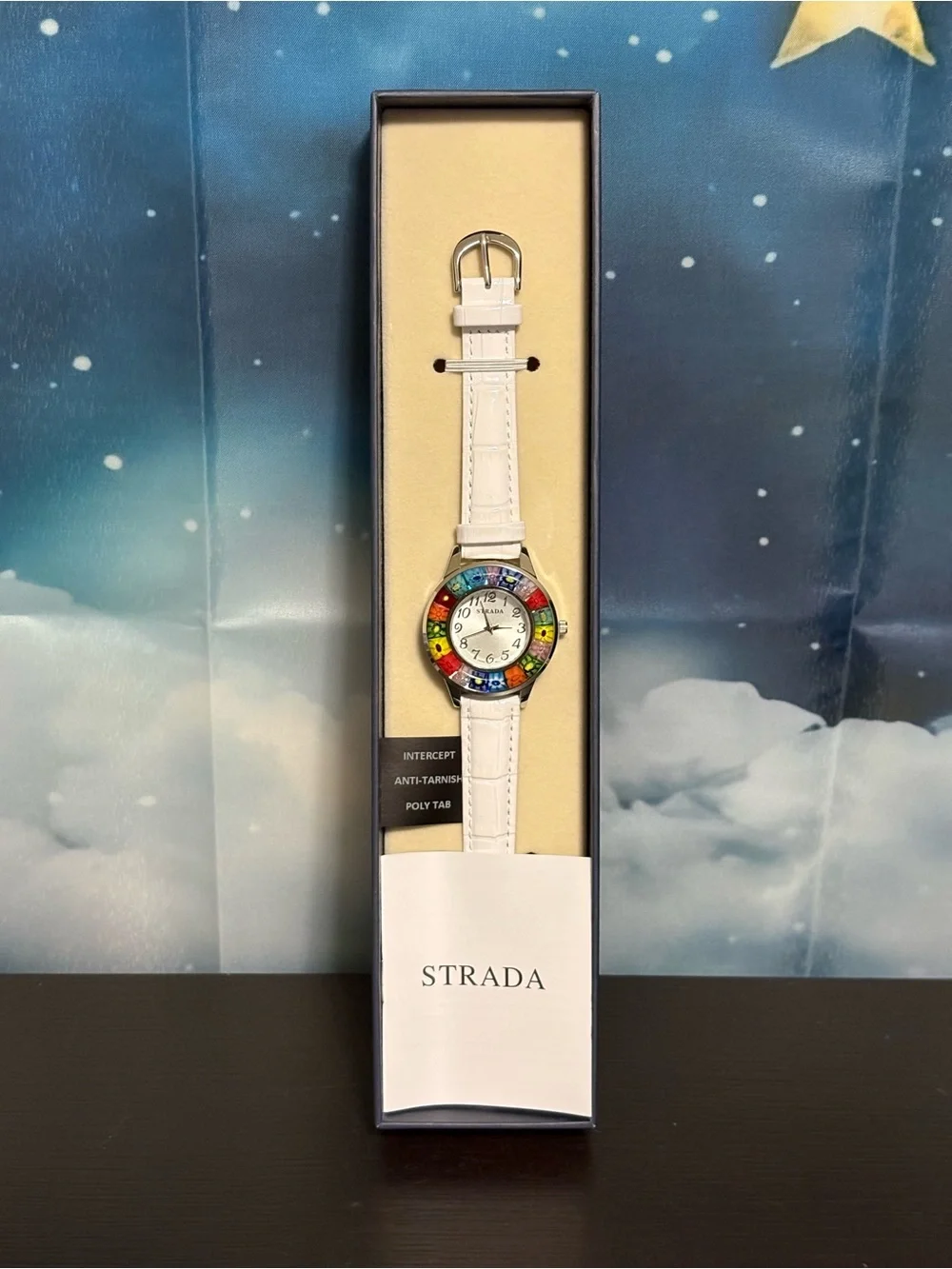 Strada watch multicolored floral millefiori bezel white band. New in box.